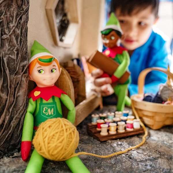 The Elf on the Shelf Elf Mates Cobbler with Red Hair – Enchanted Forest Edition Doll with Scarf and Earmuffs – Champion of Kindness – for Ages 3+.