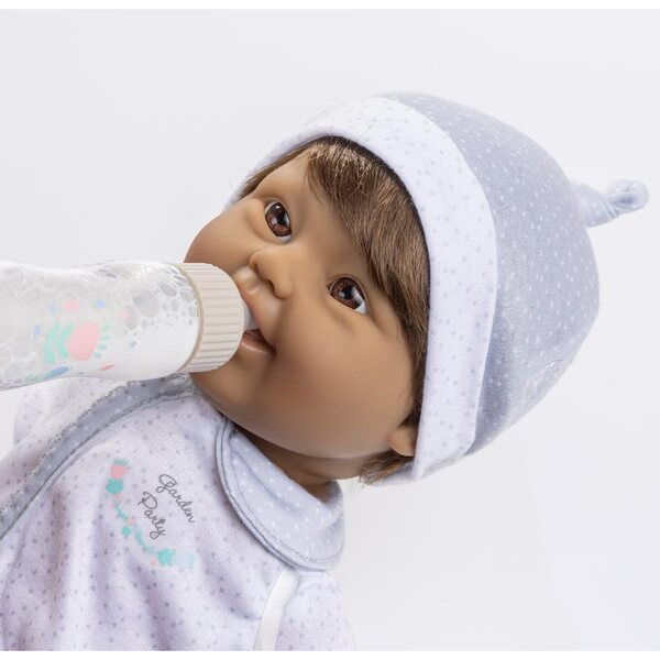 Miękka lalka o średnicy 40 cm z zespołem Downa, brązowymi włosami i magiczną butelką JC Toys