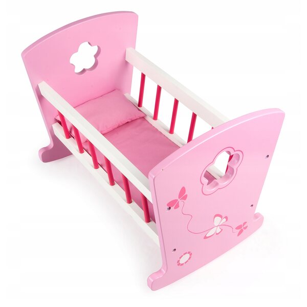 Roze houten wieg voor poppen in vlinderstijl en linnengoed inbegrepen