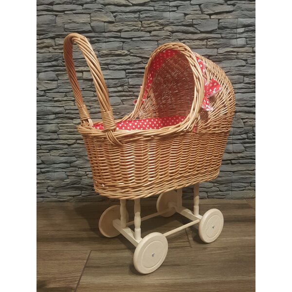 Puppenwagen aus Korbgeflecht mit roter Schleife und beweglichen Rädern