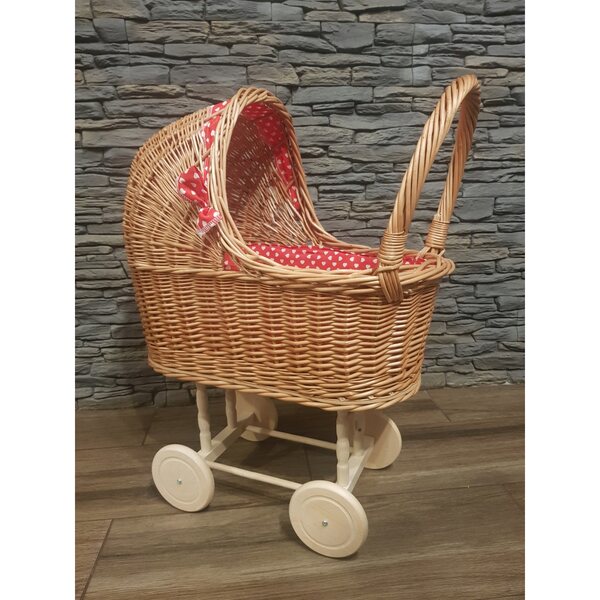 Puppenwagen aus Korbgeflecht mit roter Schleife und beweglichen Rädern
