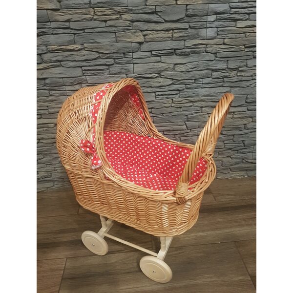 Puppenwagen aus Korbgeflecht mit roter Schleife und beweglichen Rädern