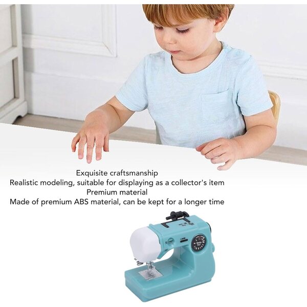 Kleine blaue Miniatur-Nähmaschine für Dekorationen und Sammlungen