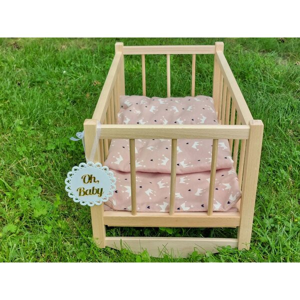 Dondolo in legno per bambole con set biancheria rosa in confezione elegante