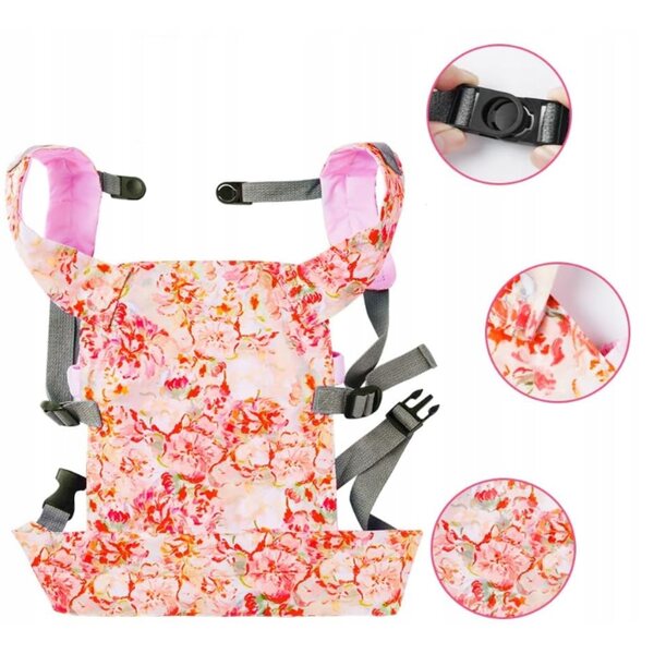 Eine Babytrage für Puppen mit verstellbaren Trägern und Blumenmuster