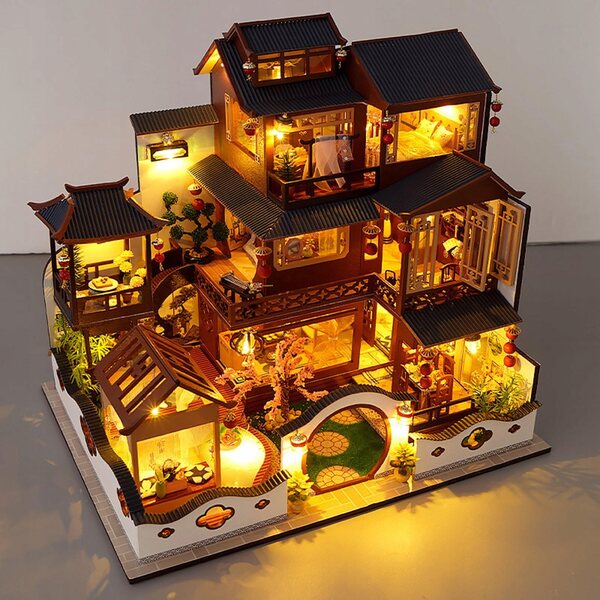 Ein DIY-Puppenhaus aus Holz mit Miniaturmöbeln und LED-Leuchten