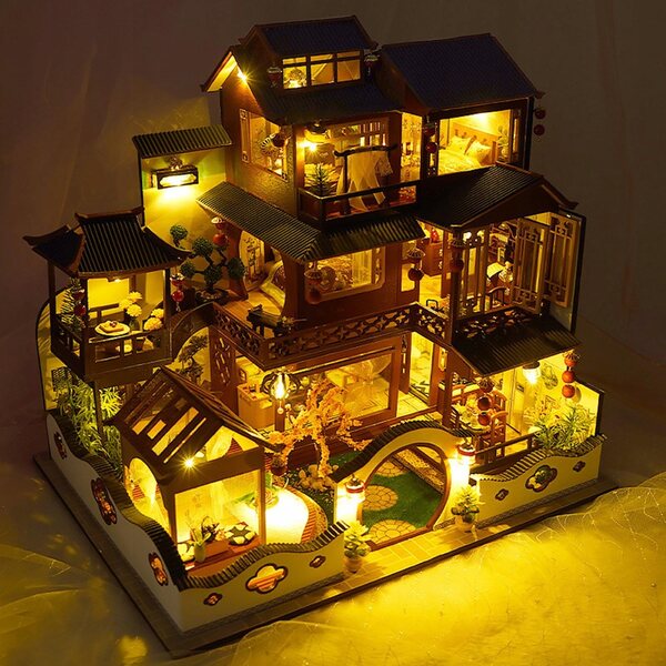 Ein DIY-Puppenhaus aus Holz mit Miniaturmöbeln und LED-Leuchten