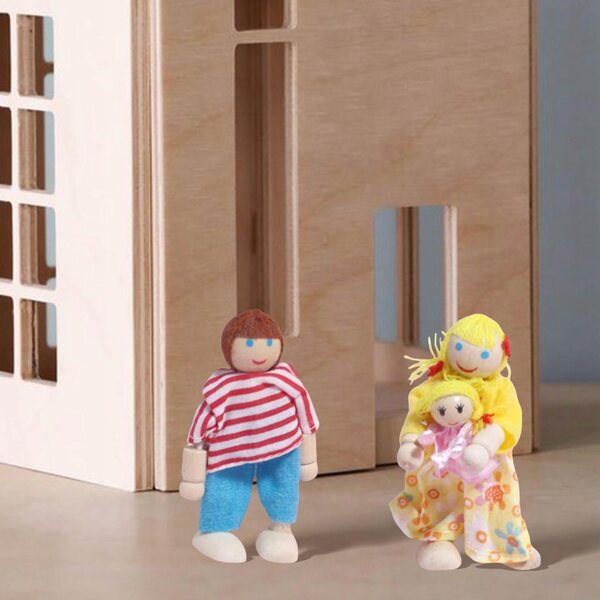 Ein hölzernes Puppenhaus mit Familienset und Miniaturzubehör für Kinder