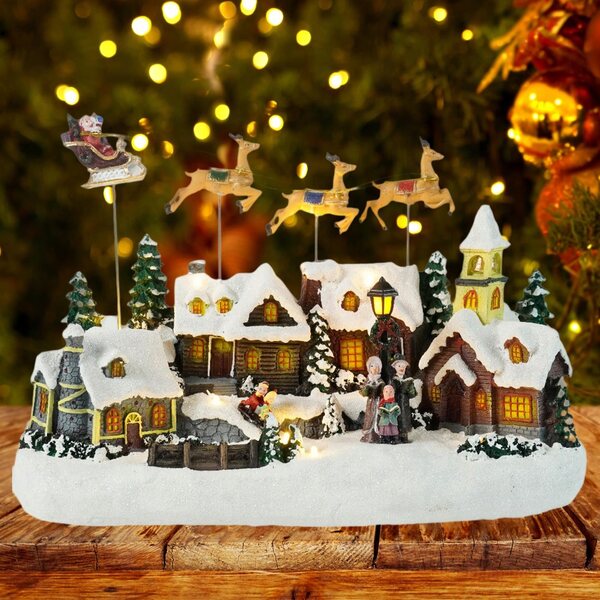 Figurina Xmas Snow Village con luci LED e musica per decorazioni natalizie