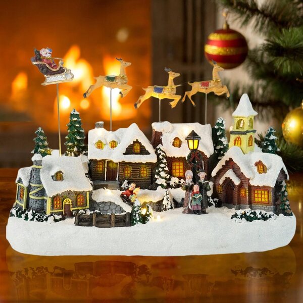 Figurina Xmas Snow Village con luci LED e musica per decorazioni natalizie