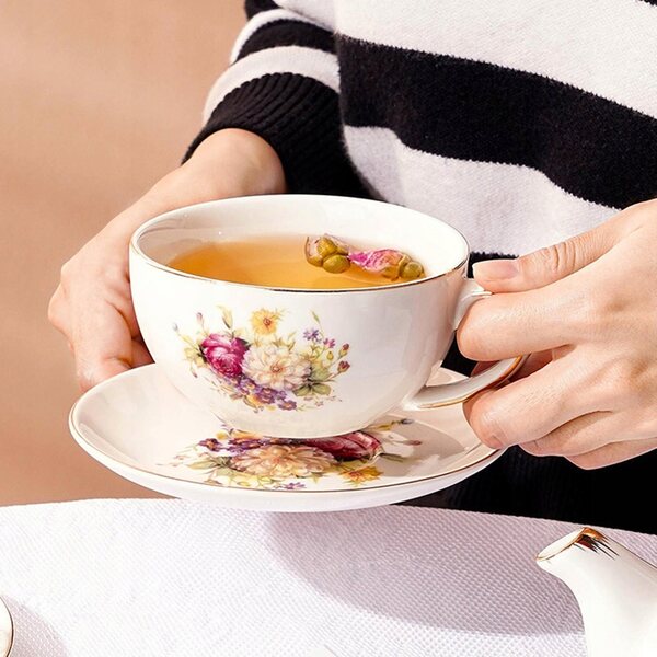 Set porcellana vintage con teiera e tazza floreale per cerimonia del tè Kung Fu
