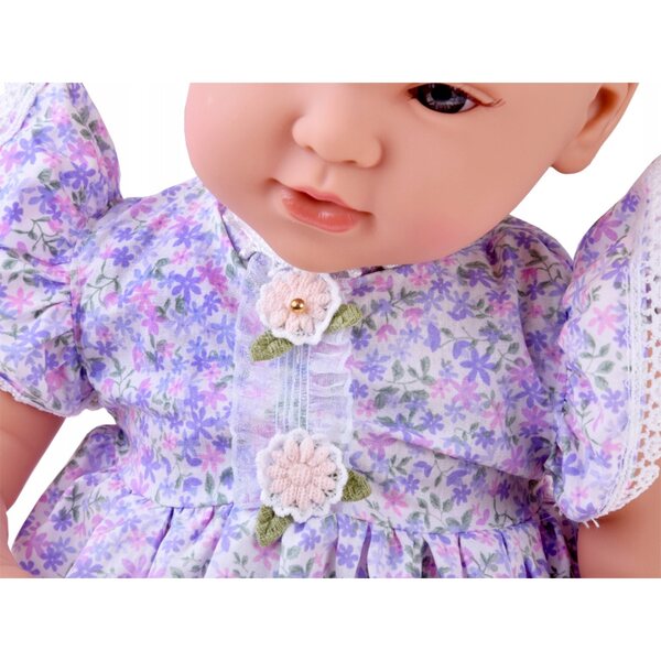 Interaktive Babypuppe 46 cm in fliederfarbenem Kleid mit Zubehör inklusive