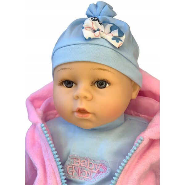 Eine sprechende und singende Babypuppe, 35 cm groß, mit Flasche und Schnuller