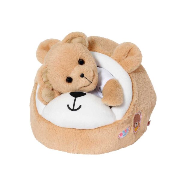 Ein mehrfarbiges Bett für die Baby Born-Puppe in Form eines Höhlenbären