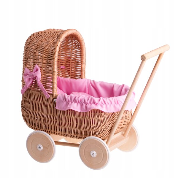 Ein Puppenwagen aus Korbgeflecht mit rosa Besatz, Bettwäsche und Holzgriff
