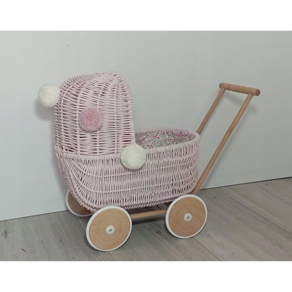 Passeggino per bambole in vimini rosa con biancheria da letto e pompon - fatto a mano