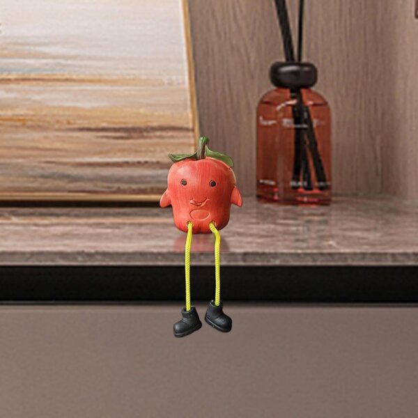 Bambola con gambe pendenti a forma di frutta per decorare casa e ufficio