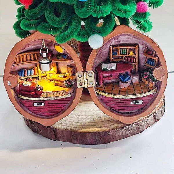 Casa delle bambole in miniatura artigianale in guscio di noce con scena 3D e luce