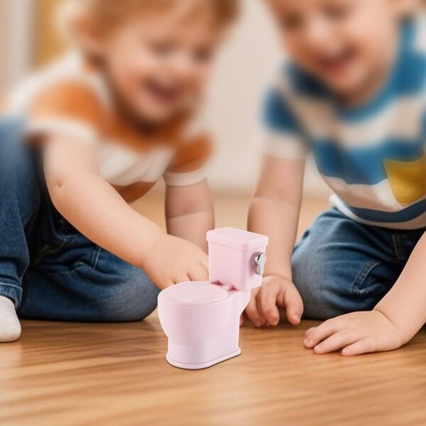 Puppenhaus-Miniaturtoilette aus rosa Kunststoff mit realistischen Geräuschen