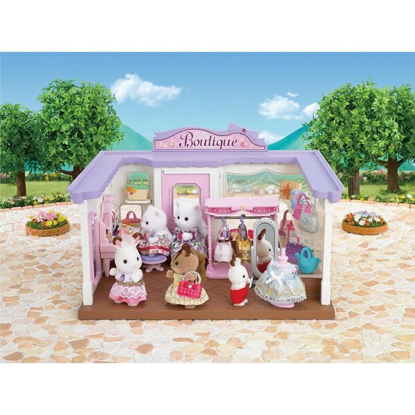 Sylvanian Families Set Dressing con Figurina Bambina Lapin Chocolat e 3 Vestiti Colorati