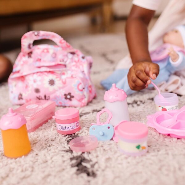 Melissa & Doug Deluxe 2-in-1 Puppenpflege- und Wickelzubehörset